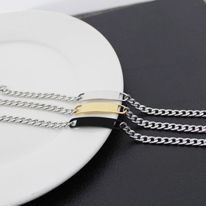 Polished stainless steel Cuban link bracelets in silver, gold and black with metal bar
