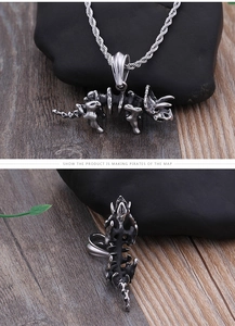 Macro view of vintage silver triceratops dinosaur skeleton pendant with rope chain detail