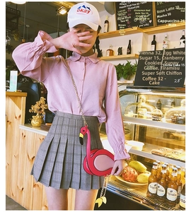 Chic pink flamingo crossbody chain bag styled with a trendy cafe outfit for women