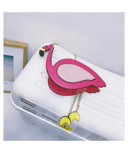 Detail of pink flamingo crossbody bag with golden chain strap and unique feet charms