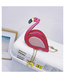 Detail shot of creative flamingo crossbody bag showing long neck and gold chain legs