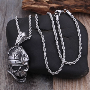 Titanium steel skull pendant with Viking helmet and silver twist chain on dark stones