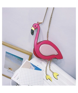 Detailed view of pink flamingo crossbody bag featuring dangling gold chain legs and metal strap