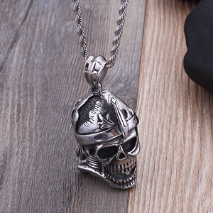 3D skull pendant necklace in silver titanium steel with wheat chain on wooden background