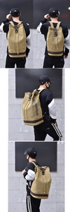 Size comparison of large and small canvas backpacks with drawstring and leather details