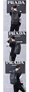 Detail view of grey canvas backpack featuring vintage drawstring closure and side lettering