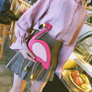 Pink flamingo shaped crossbody bag made of PU leather with a gold chain strap for women