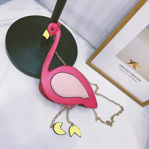 Macro shot of flamingo shoulder bag detail with pink PU leather and golden chain
