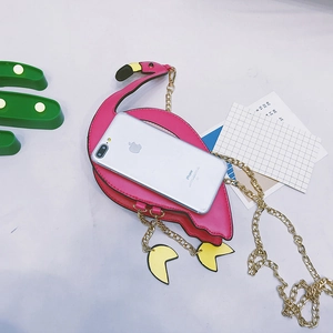 Pink flamingo crossbody bag shown next to a smartphone to demonstrate the small product size