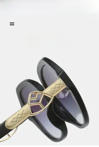 Macro shot of gold metal hinges with geometric cutouts on purple gradient sunglasses