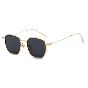 Vintage polygonal gold metal sunglasses with dark lenses and 45-degree angle side view