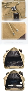 Detail of khaki canvas backpack showing drawstring closure and spacious interior storage