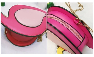 Detailed view of pink flamingo crossbody bag featuring gold chain strap and zipper closure