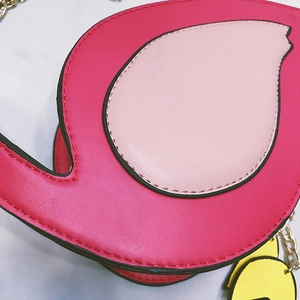 Detail shot of flamingo crossbody bag showing precise stitching and premium PU leather texture