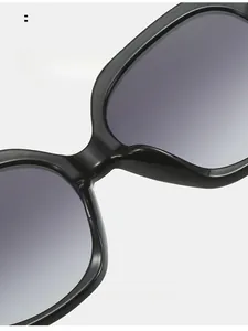 Detailed view of comfortable integrated nose pads on black oval frame sunglasses
