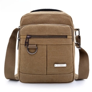 Close-up of khaki waterproof Oxford fabric messenger bag with metal D-ring and zipper detail