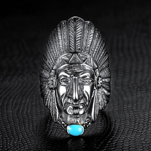 Detailed engraving of an Indian chief head on a vintage silver ring with blue gemstone
