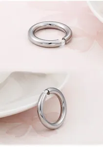 Detailed view of silver titanium steel ring with a sparkling round cubic zirconia inlay