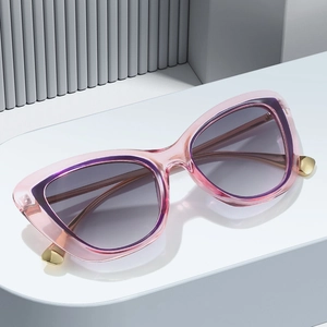 Pink cat-eye sunglasses with gradient lenses and elegant gold metal temple accents