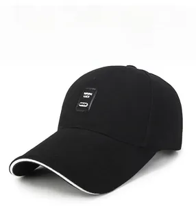 Detail of black cotton baseball cap with MADE patch and white sandwich brim design