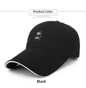 Detail of black cotton baseball cap with white brim piping and MADE rectangular patch