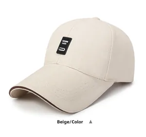 Close-up of beige cotton baseball cap featuring black TUTUPAI LUCK rubber logo patch