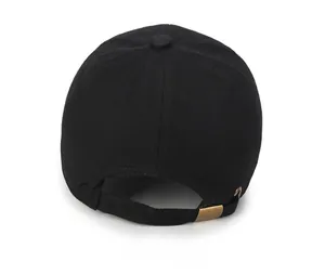 Rear view of black cotton baseball cap showing vintage bronze metal adjustment buckle