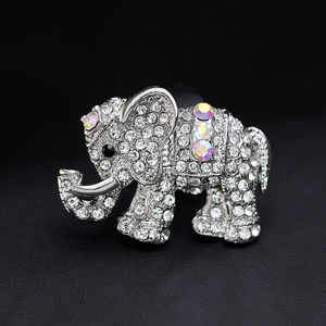 Sparkling elephant brooch with clear rhinestones and AB crystal accents on black background