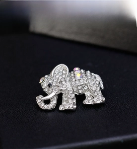 Detailed macro view of an elephant brooch encrusted with sparkling clear and AB crystals