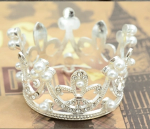 Macro detail of silver bridal crown featuring sparkling rhinestones and white pearls