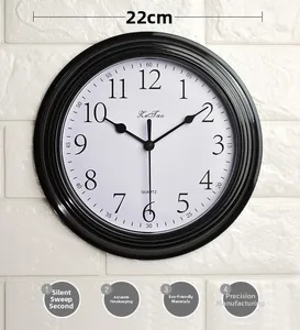 Detail view of 22cm silent wall clock with black frame and clear quartz dial numerals