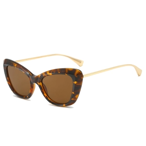 Retro cat eye tortoise shell sunglasses with slim gold metal temples from a 45-degree angle