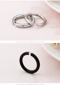 Detail of silver and black stainless steel rings with sparkling cubic zirconia inlay