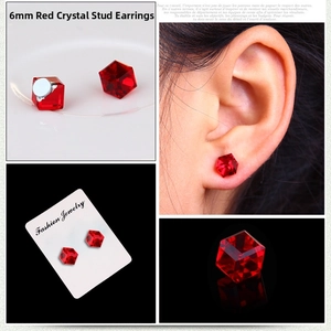 Macro detail of 6mm red cubic crystal magnetic clip-on earrings with faceted surface