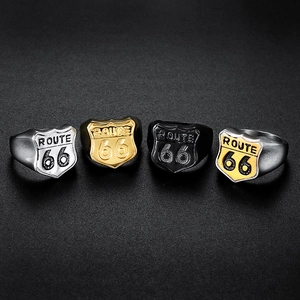 Macro shot of Route 66 shield rings in silver, gold, and black stainless steel finishes