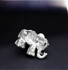 Detailed back view of silver elephant brooch showing metal pin and textured alloy finish