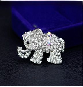Detailed close-up of elephant brooch with silver plating and sparkling rhinestones