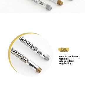 Close-up of metallic craftwork pens showing glossy gold and silver finish details