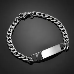 Macro shot of silver stainless steel curb chain bracelet with polished ID bar and clasp