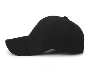 Side view detail of a classic black cotton baseball cap with structured stitching