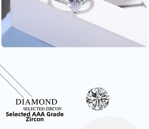 Detail of pear-cut AAA zircon on minimalist silver ring with small stones