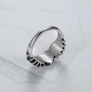 Detailed view of retro stainless steel heart wings ring with vintage engraved texture