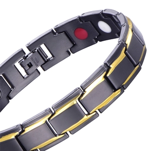 Detail showing magnetic stones inside the black and gold stainless steel bracelet