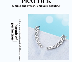 Detailed view of silver star crawler earrings with sparkling zircon stones and gradient design