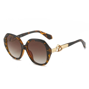 Vintage leopard print oval sunglasses with brown gradient lenses and gold metal temples