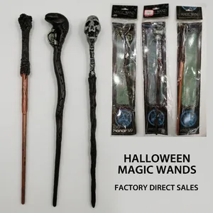 Detailed view of Halloween magic wands featuring skull, snake, and fist designs