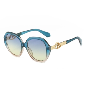 Oval sunglasses with blue frames, gradient lenses and gold geometric temple details