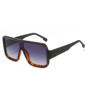 Oversized square sunglasses featuring black and tortoise frame with purple gradient lenses