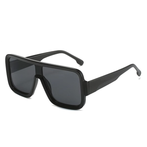 Oversized square fashion sunglasses with black resin frame and dark gray lenses