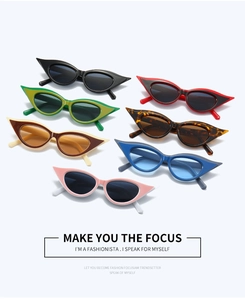 Collection of cat-eye sunglasses in seven colors with glossy plastic frames on white
